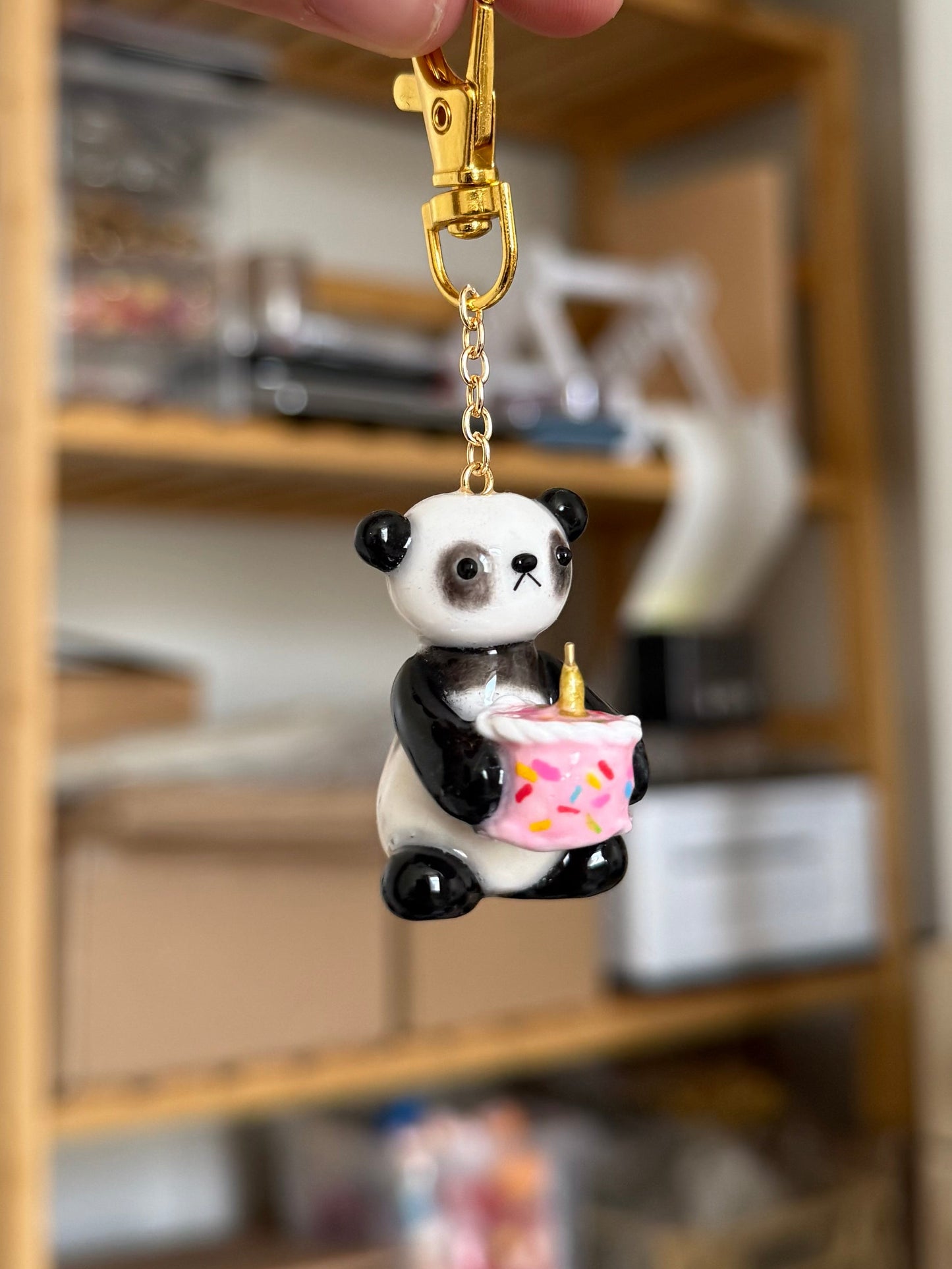 panda holding cake keychain
