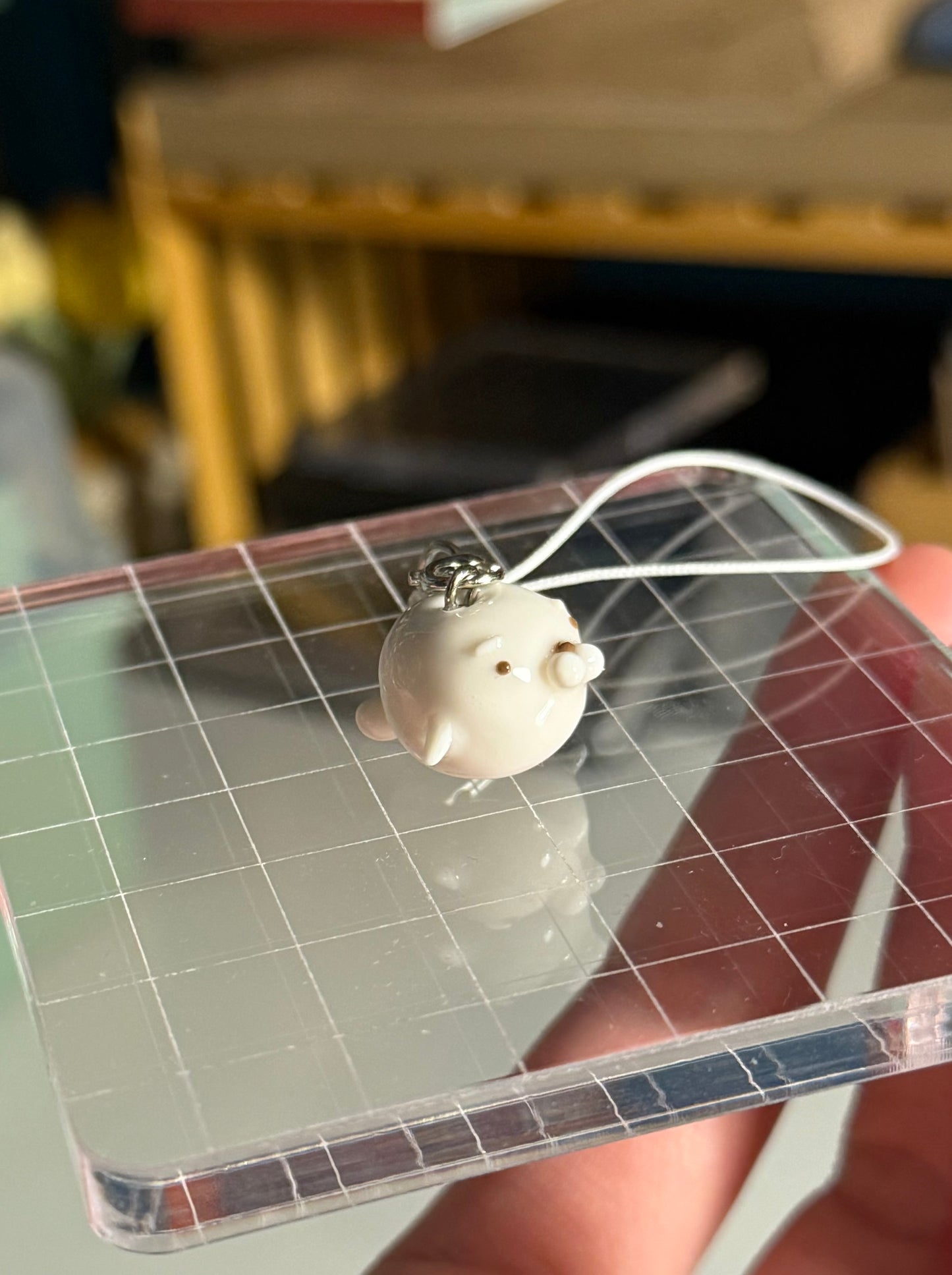 white seal phone charm